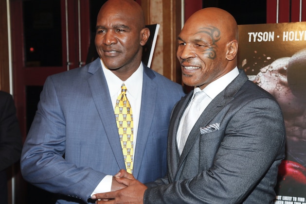 Evander Holyfield, left, and Mike Tyson, attend a special screening of