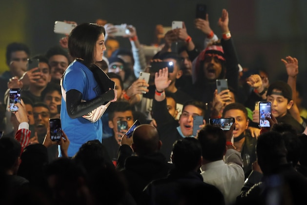 SmackDown Women's Champion Bayley is greeted by fans as she enters for the second-ever women's match in Saudi Arabia at WWE Super ShowDown in Riyadh, Saudi Arabia, late Thursday, Feb. 27, 2020. (AP Photo/Amr Nabil)