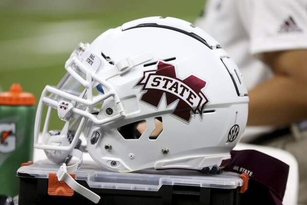 A Mississippi State helmet on the bench in the second half of their NCAA college football game against the Louisiana-Lafayette in New Orleans, Saturday, Aug. 31, 2019. Mississippi State won, 38-28. (AP Photo/Chuck Cook)
