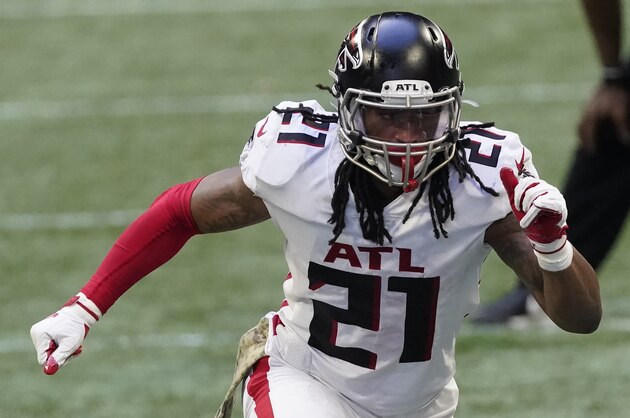 Atlanta Falcons running back Todd Gurley (21) runs against the Denver Broncos during the second half of an NFL football game, Sunday, Nov. 8, 2020, in Atlanta. (AP Photo/John Bazemore)