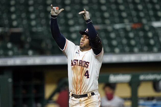 Houston Astros' George Springer celebrates after hitting a home run against the Arizona Diamondbacks during the fifth inning of a baseball game Friday, Sept. 18, 2020, in Houston. (AP Photo/David J. Phillip)