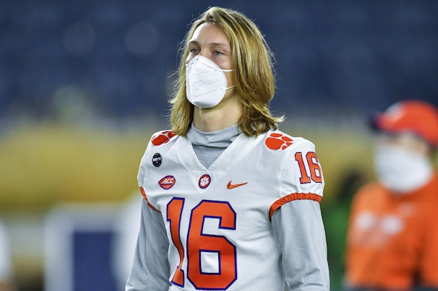 Clemson quarterback Trevor Lawrence watches players warm up for an NCAA college football game between Clemson and Notre Dame on Saturday, Nov. 7, 2020, in South Bend, Ind. (Matt Cashore/Pool Photo via AP)