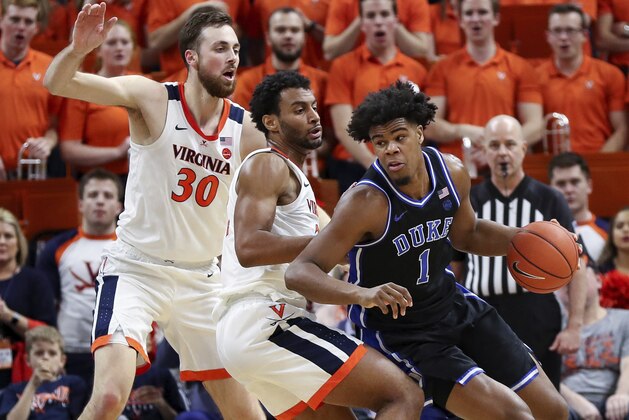 Duke center Vernon Carey Jr. (1) gets pressured by Virginia guard Braxton Key (2) and Virginia forward Jay Huff (30) during the second half of an NCAA college basketball game Saturday, Feb. 29, 2020, in Charlottesville, Va. Virginia defeated Duke 52-50. (AP Photo/Andrew Shurtleff)