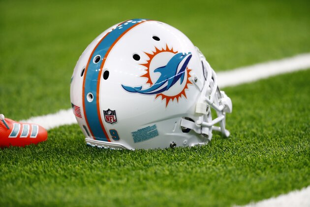Miami Dolphins helmet sits on the field during warmups before a regular season Week 8 NFL football game between the Miami Dolphins and the Houston Texans on Thursday, Oct. 25, 2018, in Houston. The Texans beat the Dolphins 42-23. (AP Photo/Matt Patterson)