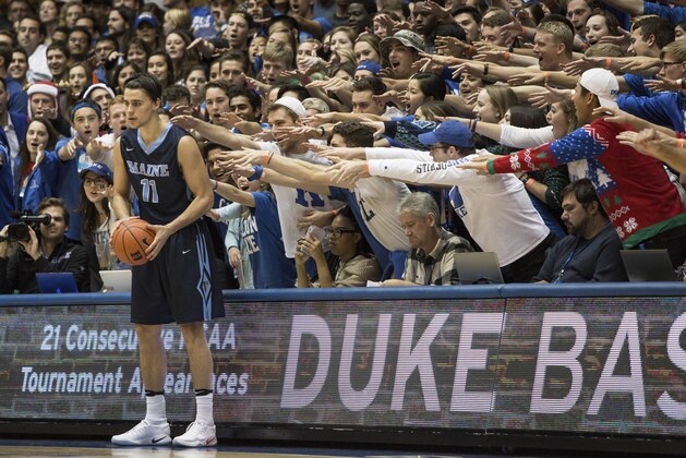 Maine's Ilija Stojiljkovic (11) looks to in-bound the ball as the Cameron Crazies shout from behind during an NCAA college basketball game against Duke in Durham, N.C., Saturday, Dec. 3, 2016. (AP Photo/Ben McKeown)