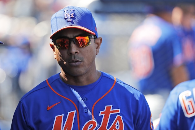 New York Mets manager Luis Rojas is seen in the dugout before the start of a spring training baseball game against the Houston Astros Saturday, Feb. 29, 2020, in West Palm Beach, Fla. (AP Photo/Jeff Roberson)
