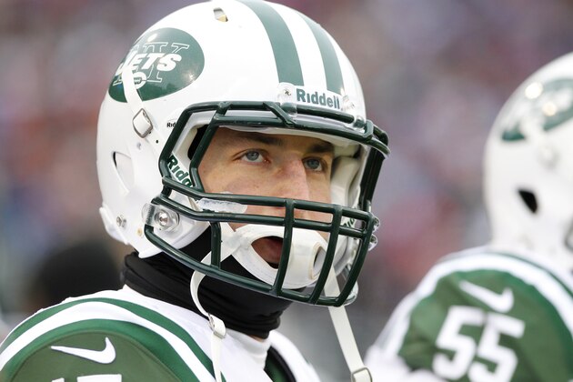 New York Jets quarterback Tim Tebow (15) stands on the sidelines during the second half of an NFL football game against the Buffalo Bills on Sunday, Dec. 30, 2012, in Orchard Park, N.Y. (AP Photo/Bill Wippert)