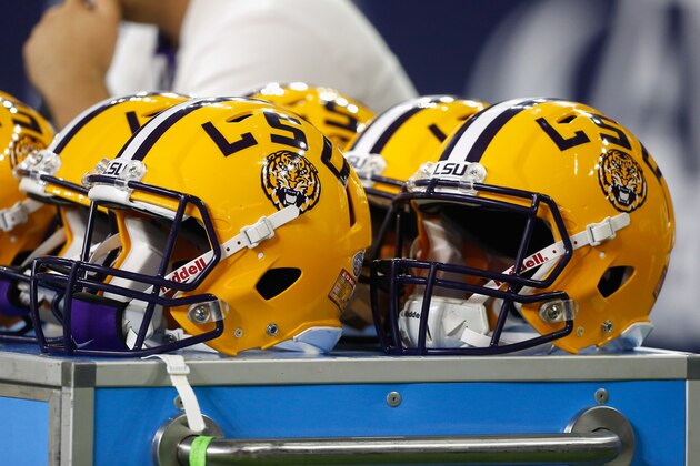 LSU helmets sit on the bench area during the Texas Bowl NCAA football game Tuesday, Dec. 29, 2015, in Houston. LSU won 56-27. (AP Photo/Bob Levey)