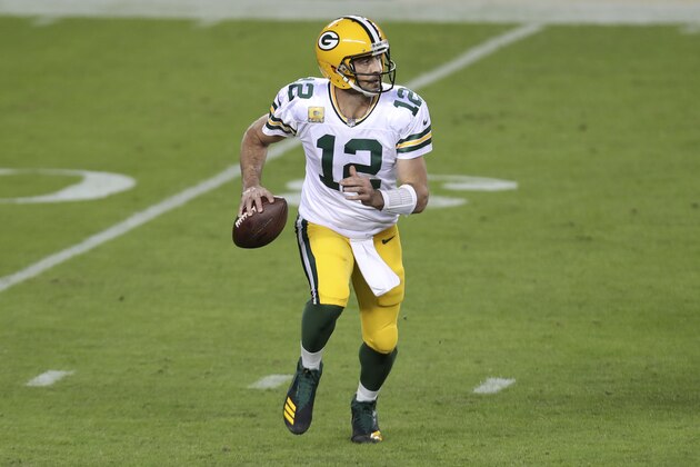 Green Bay Packers quarterback Aaron Rodgers (12) rolls out to pass against the San Francisco 49ers during the first half of an NFL football game in Santa Clara, Calif., Thursday, Nov. 5, 2020. (AP Photo/Jed Jacobsohn)