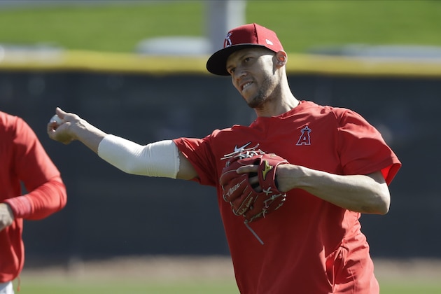 Los Angeles Angels' Andrelton Simmons throws during spring training baseball practice, Monday, Feb. 17, 2020, in Tempe, Ariz. (AP Photo/Darron Cummings)