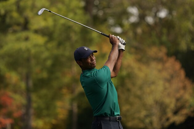Tiger Woods watches his tee shot on the 12th hole during a practice round for the Masters golf tournament Monday, Nov. 9, 2020, in Augusta, Ga. (AP Photo/Charlie Riedel)