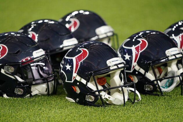 Houston Texans helmets are seen before an NFL football game against the New England Patriots Sunday, Dec. 1, 2019, in Houston. (AP Photo/David J. Phillip)