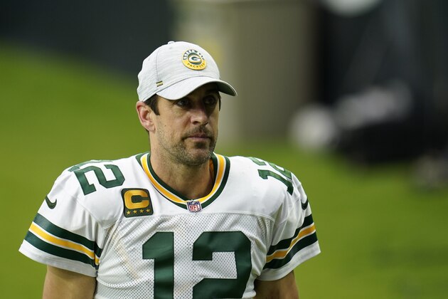 Green Bay Packers quarterback Aaron Rodgers (12) walks off the field after an NFL football game against the Houston Texans, Sunday, Oct. 11, 2020, in Houston. (AP Photo/Matt Patterson)