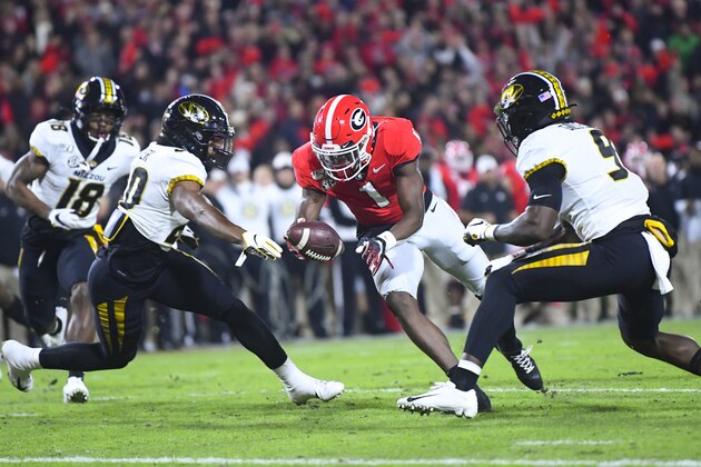 Georgia wide receiver George Pickens (1) closes in on the endzone as Missouri defensive back Khalil Oliver, left, and safety Tyree Gillespie close in before he scores a touchdown during an NCAA college football game Saturday, Nov. 9, 2019, in Athens, Ga. (AP Photo/John Amis)