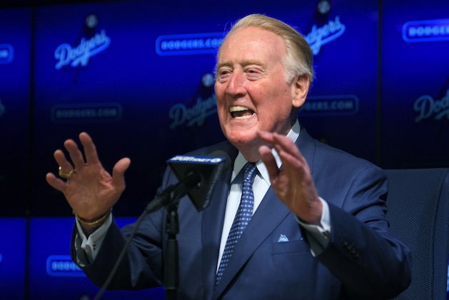 Hall of Fame broadcaster Vin Scully speaks to reporters about being inducted into the Los Angeles Dodgers Ring of Honor, prior to a baseball game between the Dodgers and the San Francisco Giants, Wednesday, May 3, 2017, in Los Angeles. (AP Photo/Mark J. Terrill)