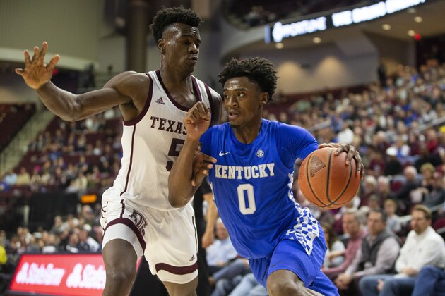 Kentucky guard Ashton Hagans (0) drives the baseline against Texas A&M forward Emanuel Miller (5) during the first half of an NCAA college basketball game Tuesday, Feb. 25, 2020, in College Station, Texas. (AP Photo/Sam Craft)
