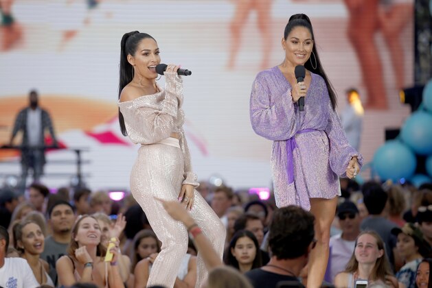 Nikki Bella, left, and Brie Bella introduce a performance by Blanco Brown at the Teen Choice Awards on Sunday, Aug. 11, 2019, in Hermosa Beach, Calif. (Photo by Danny Moloshok/Invision/AP)