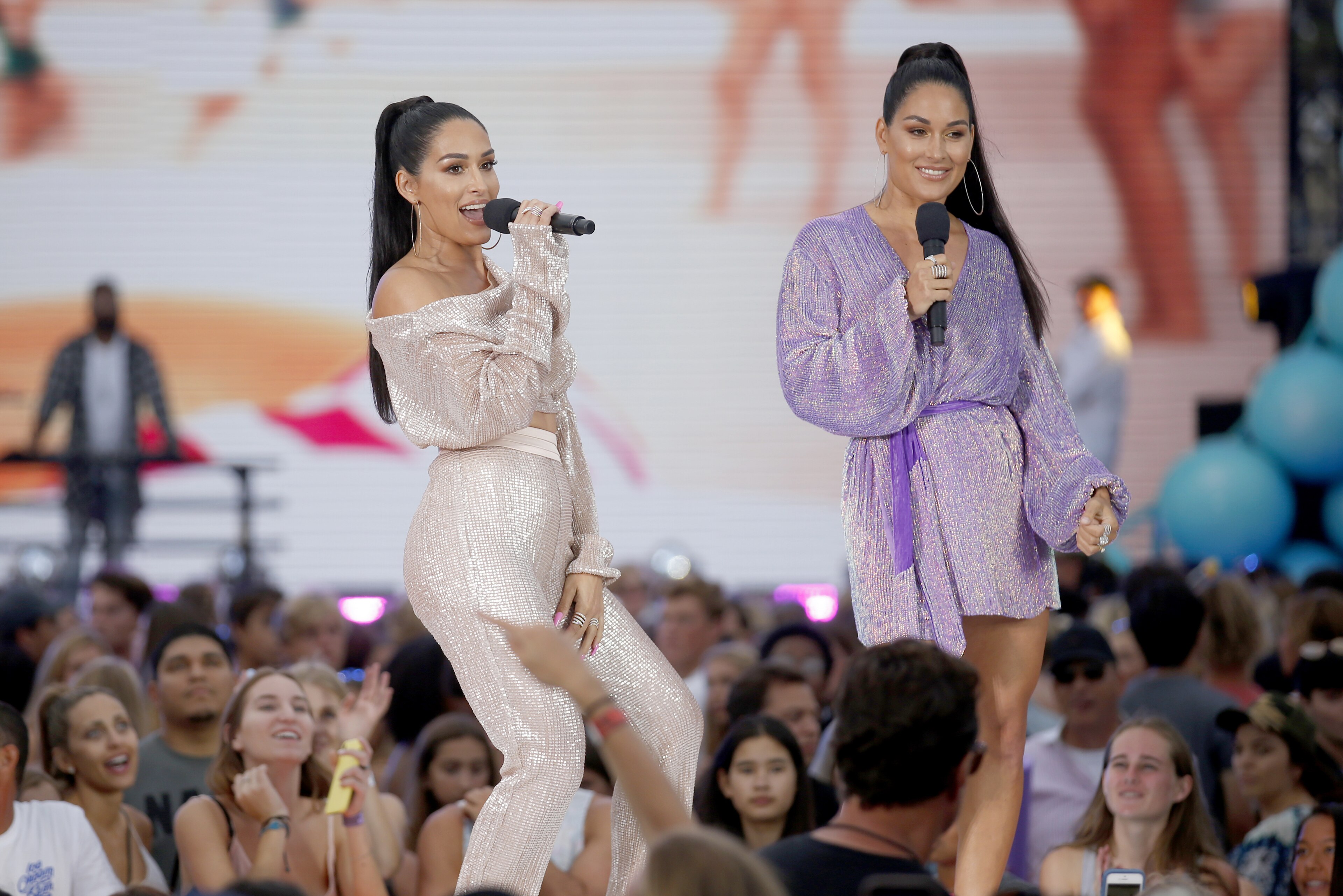 Nikki Bella, left, and Brie Bella introduce a performance by Blanco Brown at the Teen Choice Awards on Sunday, Aug. 11, 2019, in Hermosa Beach, Calif. (Photo by Danny Moloshok/Invision/AP)