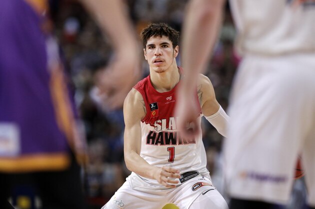 LaMelo Ball of the Illawarra Hawks looks for an opening during their game against the Sydney Kings in the Australian Basketball League in Sydney, Sunday, Nov. 17, 2019. (AP Photo/Rick Rycroft)