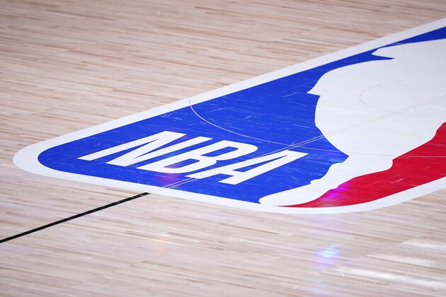 The court floor and league logo are shown after Game 3 of the NBA basketball Western Conference final between the Los Angeles Lakers and Denver Nuggets on Tuesday, Sept. 22, 2020, in Lake Buena Vista, Fla. (AP Photo/Mark J. Terrill) The court floor and league logo are shown after Game 3 of the NBA basketball Western Conference final between the Los Angeles Lakers and Denver Nuggets on Tuesday, Sept. 22, 2020, in Lake Buena Vista, Fla. (AP Photo/Mark J. Terrill)