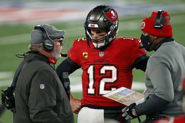 Tampa Bay Buccaneers quarterback Tom Brady (12) talks with head coach Bruce Arians and offensive coordinator Byron Leftwich during an NFL football game against the New York Giants, Monday, Nov. 2, 2020, in East Rutherford, N.J. (AP Photo/Adam Hunger)