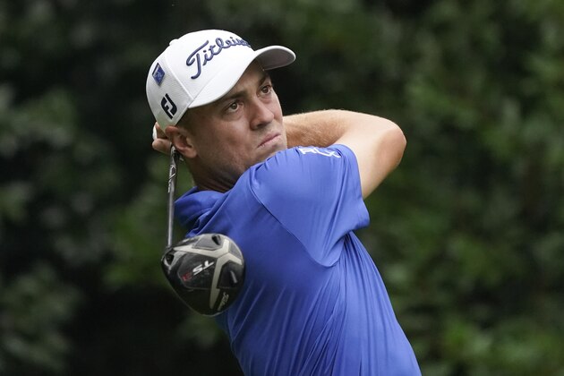 Justin Thomas watches his tee shot on the 11th hole during a practice round at the Masters golf tournament Wednesday, Nov. 11, 2020, in Augusta, Ga. (AP Photo/Charlie Riedel)