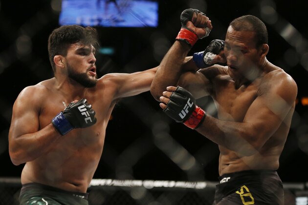 Ronaldo Souza, right, from Brazil, fights Kelvin Gastelum, from the United States, during their UFC middleweight mixed martial arts bout in Rio de Janeiro, Brazil, early Sunday, May 13, 2018. (AP Photo/Leo Correa)