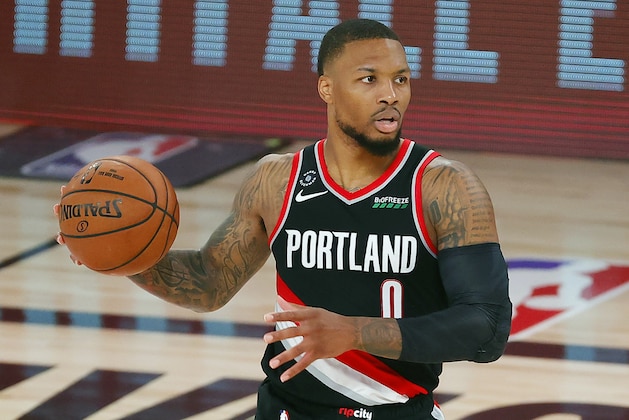 Portland Trail Blazers' Damian Lillard (0) dribbles during the second half of an NBA basketball game against the Houston Rockets Tuesday, Aug. 4, 2020, in Lake Buena Vista, Fla. (Kevin C. Cox/Pool Photo via AP)