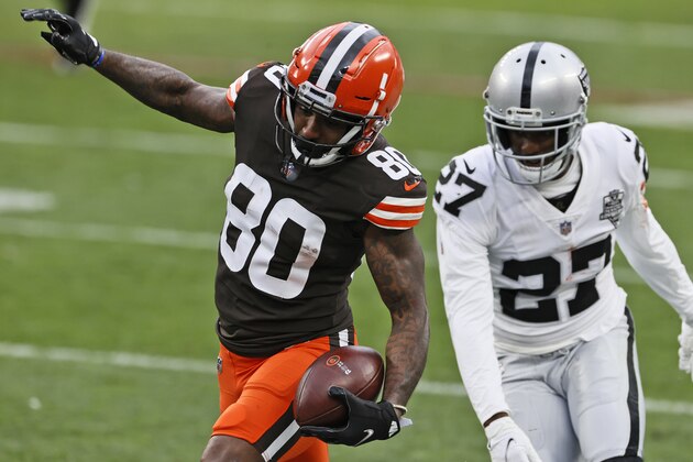 Cleveland Browns wide receiver Jarvis Landry (80) tip toes down the sideline after a catch as Las Vegas Raiders cornerback Trayvon Mullen (27) defends during the second half of an NFL football game, Sunday, Nov. 1, 2020, in Cleveland. (AP Photo/Ron Schwane)