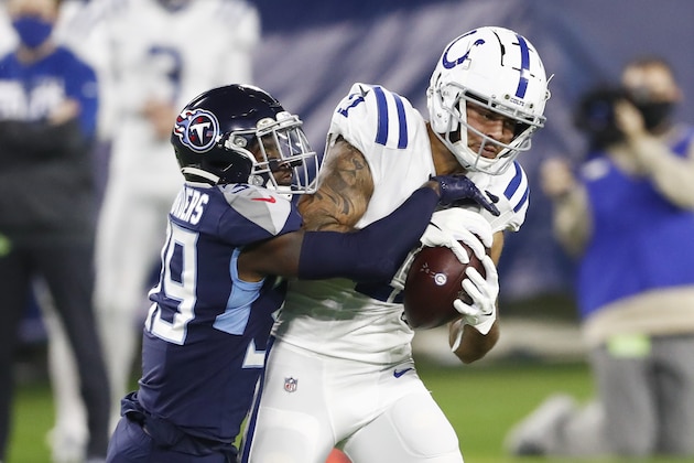 Indianapolis Colts wide receiver Michael Pittman (11) hangs onto a pass as he is defended by Tennessee Titans cornerback Breon Borders (39) in the first half of an NFL football game Thursday, Nov. 12, 2020, in Nashville, Tenn. (AP Photo/Wade Payne) Indianapolis Colts wide receiver Michael Pittman (11) hangs onto a pass as he is defended by Tennessee Titans cornerback Breon Borders (39) in the first half of an NFL football game Thursday, Nov. 12, 2020, in Nashville, Tenn. (AP Photo/Wade Payne)
