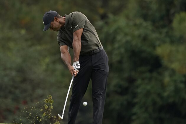 Tiger Woods hits on the 15th fairway during the first round of the Masters golf tournament Thursday, Nov. 12, 2020, in Augusta, Ga. (AP Photo/Charlie Riedel)