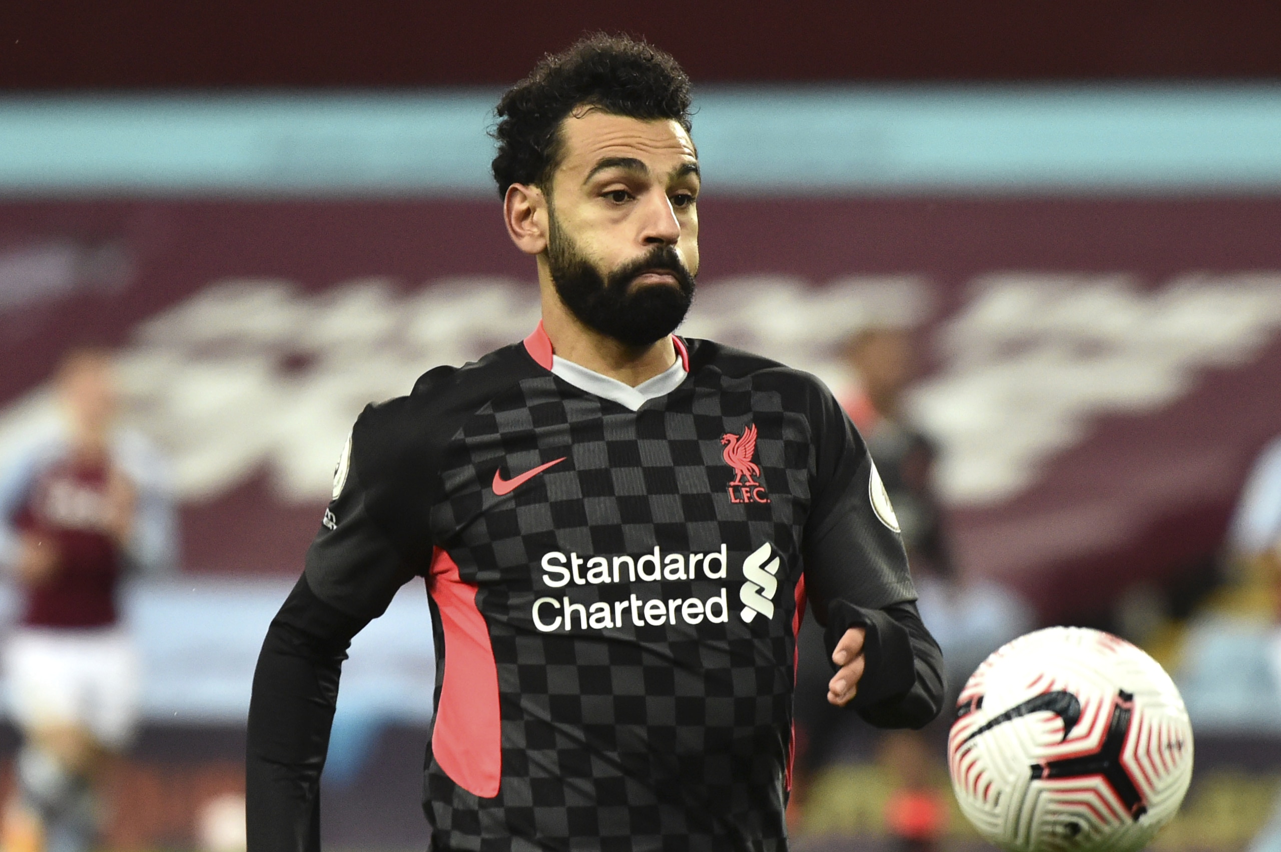 Liverpool's Mohamed Salah during the English Premier League soccer match between Aston Villa and Liverpool at Villa Park in Birmingham, England, Sunday, Oct. 4, 2020. (AP Photo/Rui Vieira)