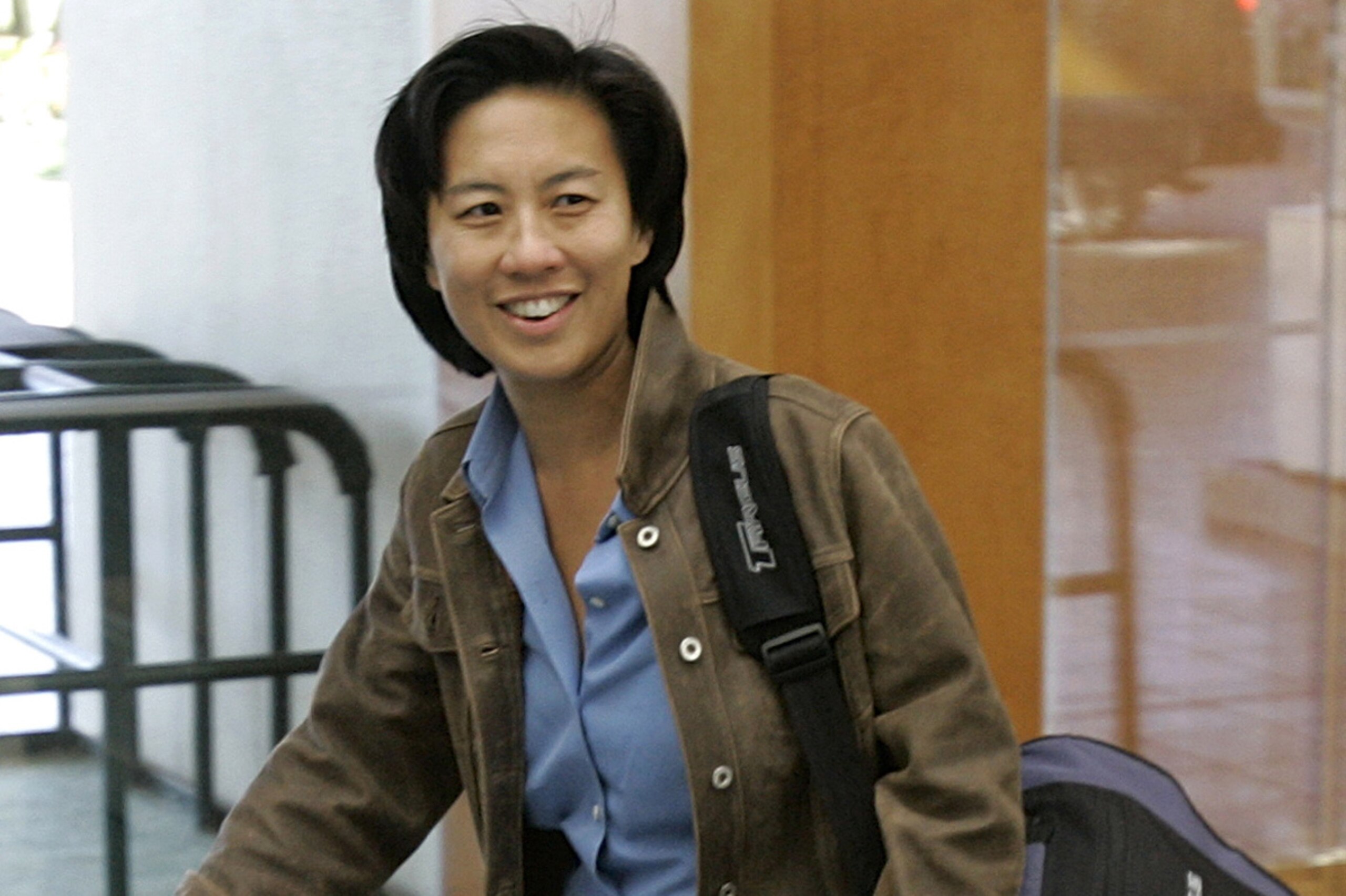 ** FILE ** Los Angeles Dodgers assistant general manager Kim Ng walks through the hotel lobby during the first day of Major League Baseball annual general managers meetings in Orlando, Fla., in this Nov. 5, 2007 file photo. (AP Photo/John Raoux, file)