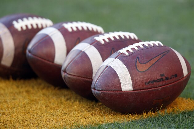 Footballs lay in a row during warmups before an NCAA college football game between Tennessee and Missouri Saturday, Nov. 17, 2018, in Knoxville, Tenn. (AP Photo/Wade Payne)