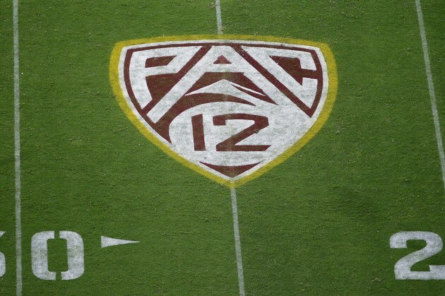 FILE - This Aug. 29, 2019, file photo shows the Pac-12 logo at Sun Devil Stadium during the second half of an NCAA college football game between Arizona State and Kent State in Tempe, Ariz. The Pac-12 has become the second major conference to shift to a conference-only fall schedule amid growing concerns over the coronavirus pandemic. (AP Photo/Ralph Freso, File)