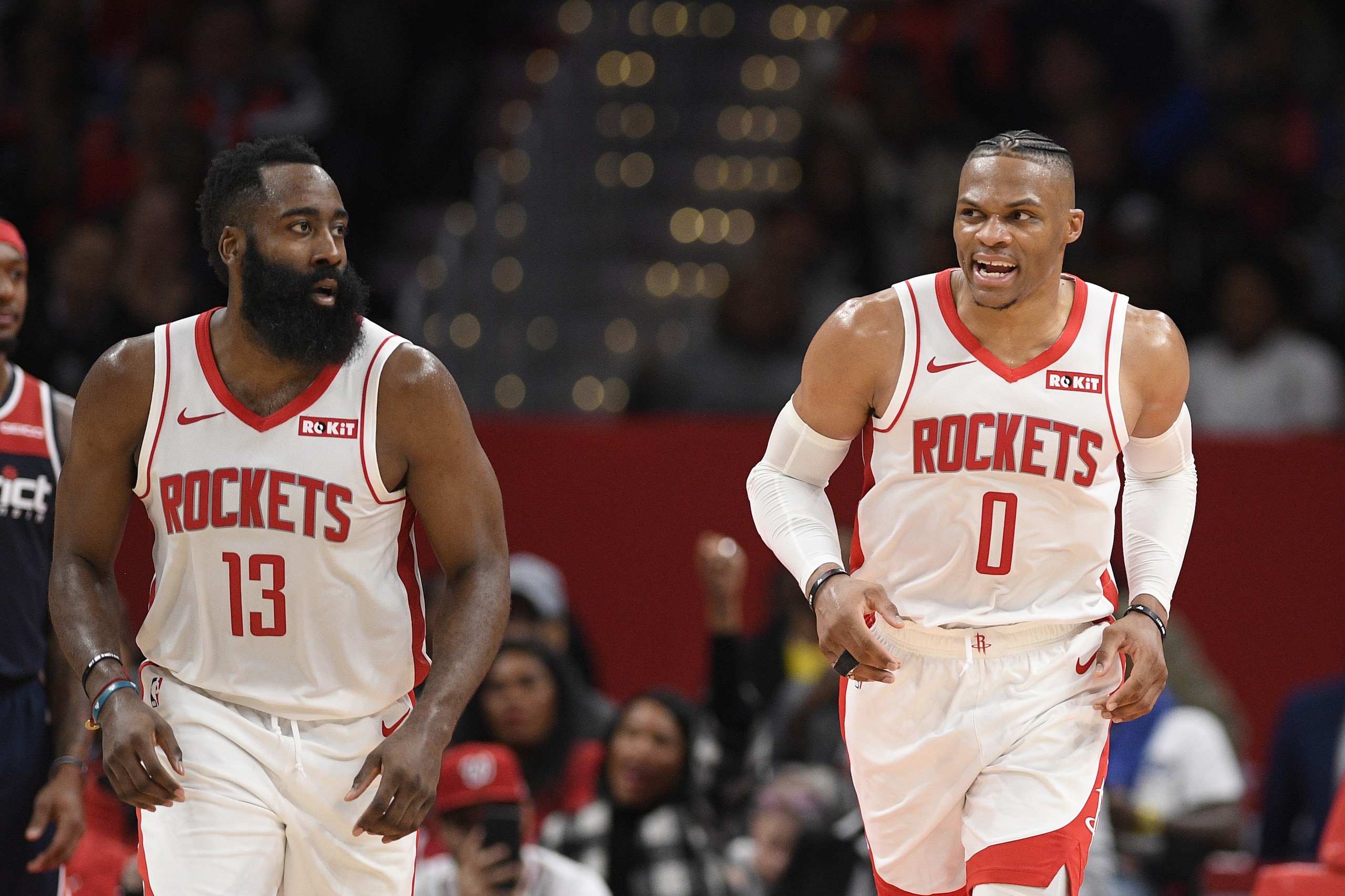 Houston Rockets guard Russell Westbrook (0) reacts next to guard James Harden (13) during the second half of an NBA basketball game against the Washington Wizards, Wednesday, Oct. 30, 2019, in Washington. The Rockets won 159-158. (AP Photo/Nick Wass)