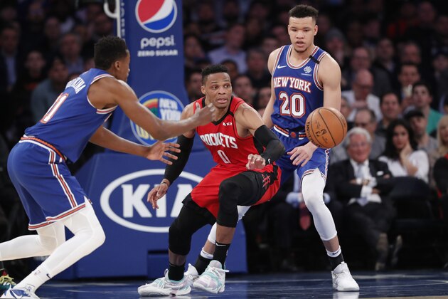 Houston Rockets guard Russell Westbrook (0) loses the ball in front of New York Knicks guard Frank Ntilikina, left, and forward Kevin Knox II, right, during the second half of an NBA basketball game in New York, Monday, March 2, 2020. (AP Photo/Kathy Willens)