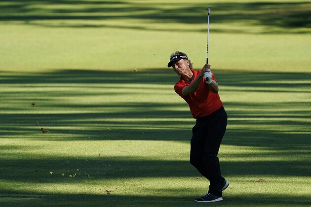 Bernhard Langer, of Germany, hits on the 15th hole during the second round of the Masters golf tournament Friday, Nov. 13, 2020, in Augusta, Ga. (AP Photo/David J. Phillip)