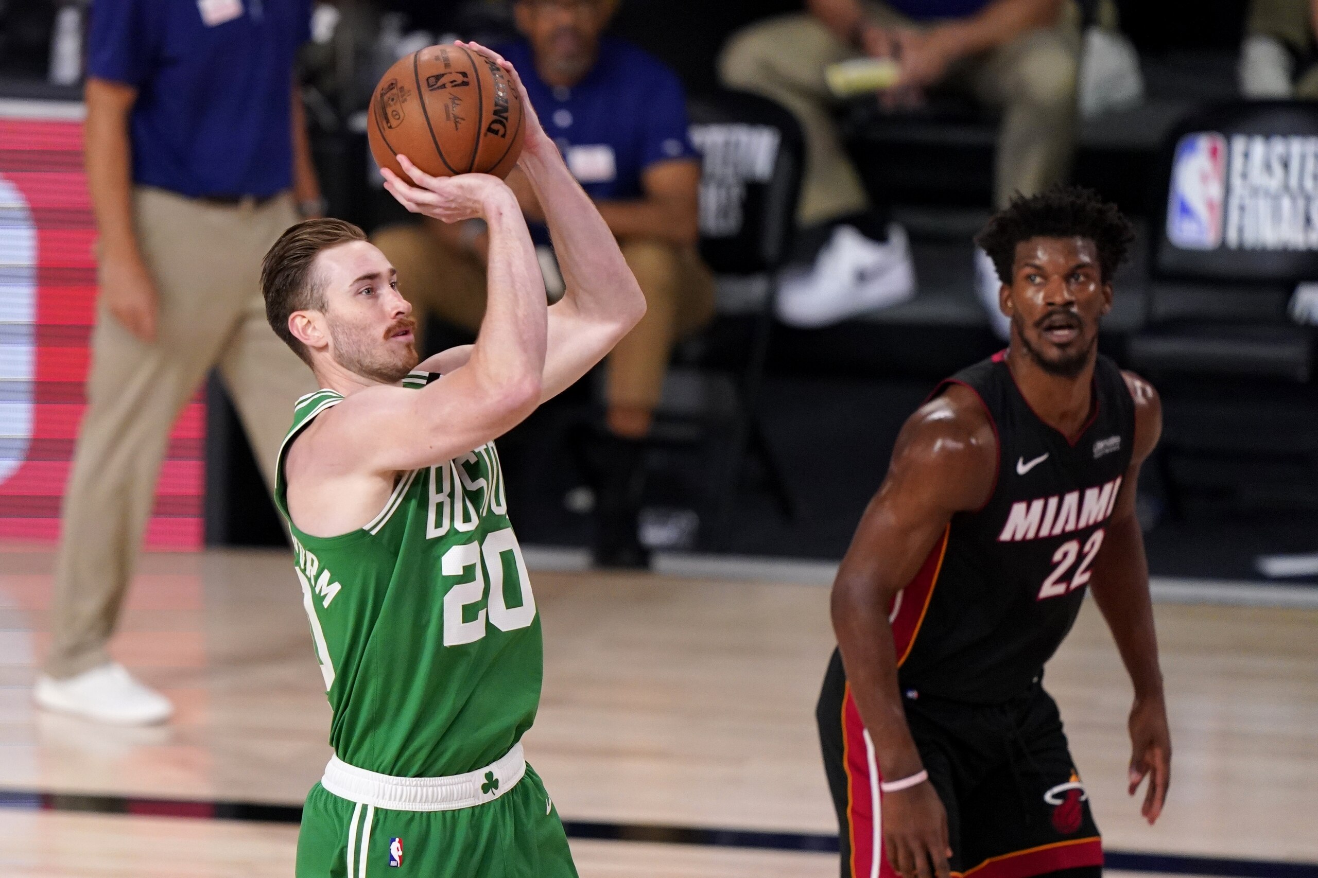 Boston Celtics forward Gordon Hayward (20) takes a shot as Miami Heat's Jimmy Butler (22) looks on during the second half of Game 4 of an NBA basketball Eastern Conference final, Wednesday, Sept. 23, 2020, in Lake Buena Vista, Fla. (AP Photo/Mark J. Terrill)