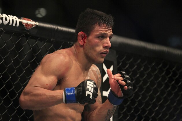 Rafael Dos Anjos fights Gleison Tibau during a UFC 139 Mixed Martial Arts lightweight bout in San Jose, Calif., Saturday, Nov. 19, 2011. (AP Photo/Jeff Chiu)