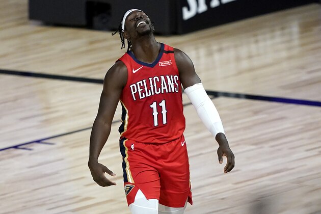 New Orleans Pelicans' Jrue Holiday reacts during the first half of an NBA basketball game against the Sacramento Kings Thursday, Aug. 6, 2020 in Lake Buena Vista, Fla. (AP Photo/Ashley Landis, Pool)