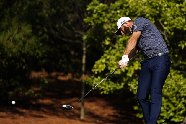 Dustin Johnson hits on the fifth fairway during the final round of the Masters golf tournament Sunday, Nov. 15, 2020, in Augusta, Ga. (AP Photo/Matt Slocum)