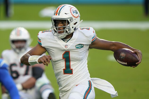 Miami Dolphins quarterback Tua Tagovailoa (1) runs the football during the first half of an NFL football game against the Los Angeles Chargers, Sunday, Nov. 15, 2020, in Miami Gardens, Fla. (AP Photo/Wilfredo Lee)