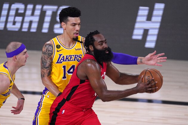 Houston Rockets' James Harden, right, drives toward the basket as Los Angeles Lakers' Danny Green (14) defends during the second half of an NBA conference semifinal playoff basketball game Thursday, Sept. 10, 2020, in Lake Buena Vista, Fla. (AP Photo/Mark J. Terrill)