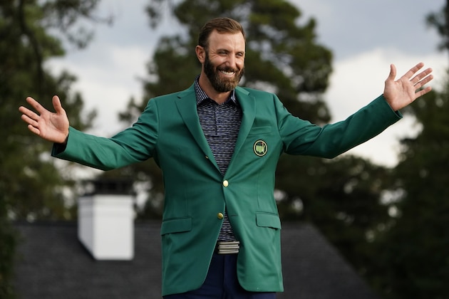 Masters golf champion Dustin Johnson shows off his green jacket after his victory Sunday, Nov. 15, 2020, in Augusta, Ga. (AP Photo/Matt Slocum)