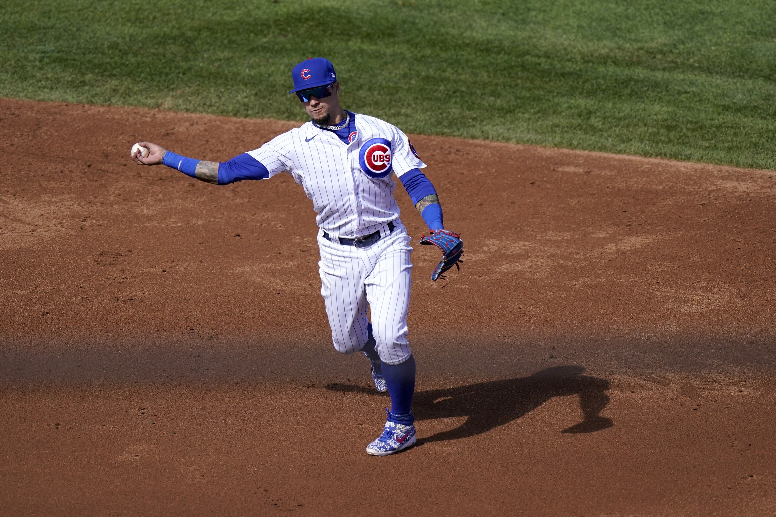 Chicago Cubs shortstop Javier Baez throws out Miami Marlins' Chad Wallach at first during the third inning in Game 2 of a National League wild-card baseball series Friday, Oct. 2, 2020, in Chicago. (AP Photo/Nam Y. Huh) Chicago Cubs shortstop Javier Baez throws out Miami Marlins' Chad Wallach at first during the third inning in Game 2 of a National League wild-card baseball series Friday, Oct. 2, 2020, in Chicago. (AP Photo/Nam Y. Huh)
