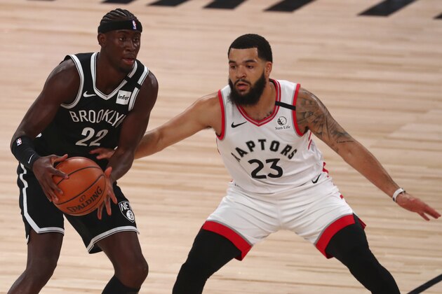 Toronto Raptors guard Fred VanVleet (23) swipes for the ball held by Brooklyn Nets guard Caris LeVert (22) during the first half of Game 1 of an NBA basketball first-round playoff series, Monday, Aug. 17, 2020, in Lake Buena Vista, Fla. (Kim Klement/Pool Photo via AP)
