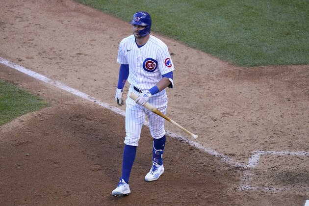 Chicago Cubs' Kris Bryant walks the dugout after striking out against the Miami Marlins in the eighth inning of Game 1 of a National League wild-card baseball series in Chicago, Wednesday, Sept. 30, 2020. (AP Photo/Nam Y. Huh)