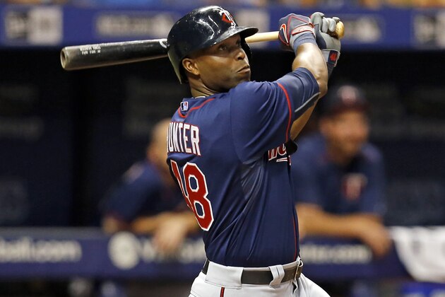 Minnesota Twins' Torii Hunter follows through on a swing during the fourth inning of a baseball game against the Tampa Bay Rays Thursday, Aug. 27, 2015, in St. Petersburg, Fla. (AP Photo/Mike Carlson)