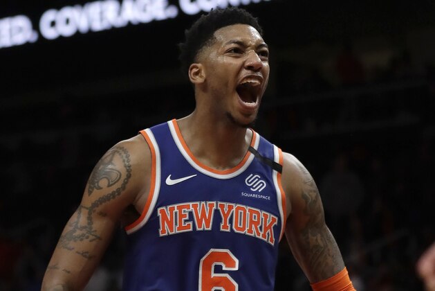 New York Knicks guard Elfrid Payton (6) rects after a basket during the second half of an NBA basketball game against the Atlanta Hawks Wednesday, March 11, 2020, in Atlanta. (AP Photo/John Bazemore)